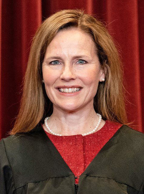 Associate Justice of the Supreme Court Amy Coney Barrett stands during a group photo of the Justices at the Supreme Court in Washington, DC on April 23, 2021. Credit: Erin Schaff \/ Pool via
