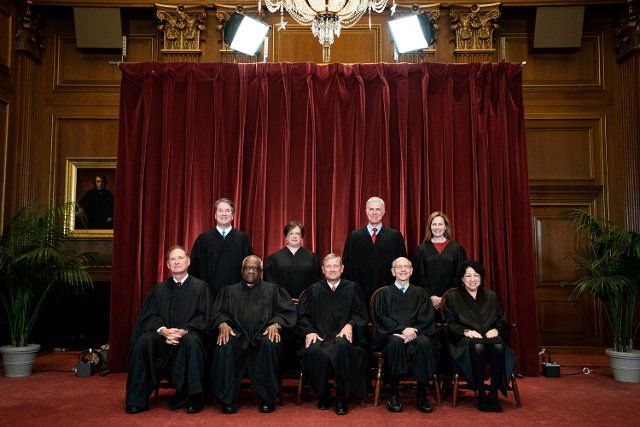 Members of the Supreme Court pose for a group photo at the Supreme Court in Washington, DC on April 23, 2021. Seated from left: Associate Justice of the Supreme Court Samuel A. Alito, Jr., Associate Justice of the Supreme Court Clarence Thomas, Chief Justice of the United States John G. Roberts, Jr., Associate Justice of the Supreme Court Stephen G. Breyer, and Associate Justice of the Supreme Court Sonia Sotomayor, Standing from left: Associate Justice of the Supreme Court Brett Kavanaugh, Associate Justice of the Supreme Court Elena Kagan, Associate Justice of the Supreme Court Neil M. Gorsuch and Associate Justice of the Supreme Court Amy Coney Barrett. Credit: Erin Schaff \/ Pool via