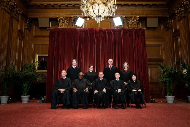 Members of the Supreme Court pose for a group photo at the Supreme Court in Washington, DC on April 23, 2021. Seated from left: Associate Justice of the Supreme Court Samuel A. Alito, Jr., Associate Justice of the Supreme Court Clarence Thomas, Chief Justice of the United States John G. Roberts, Jr., Associate Justice of the Supreme Court Stephen G. Breyer, and Associate Justice of the Supreme Court Sonia Sotomayor, Standing from left: Associate Justice of the Supreme Court Brett Kavanaugh, Associate Justice of the Supreme Court Elena Kagan, Associate Justice of the Supreme Court Neil M. Gorsuch and Associate Justice of the Supreme Court Amy Coney Barrett. Credit: Erin Schaff \/ Pool via