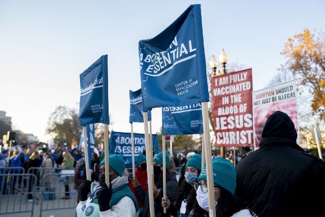 Pro-Life and Pro- Choice demonstrators gather outside the United States Supreme Court in Washington DC on Wednesday, December 1, 2021. Supreme Court Justices heard oral arguments on Dobbs v. Jackson Women\