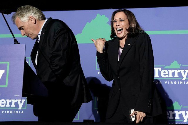 United States Vice President Kamala Harris, right, reacts at a campaign event for Terry McAuliffe, the Democratic Party nominee for Governor of Virginia, left, in Dumfries, Virginia on Thursday, October 21, 2021. Credit: Yuri Gripas \/ Pool via