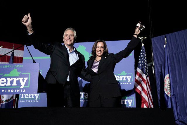 United States Vice President Kamala Harris, right, and Terry McAuliffe, the Democratic Party nominee for Governor of Virginia, left, wave to the crowd at his campaign event in Dumfries, Virginia on Thursday, October 21, 2021. Credit: Yuri Gripas \/ Pool via