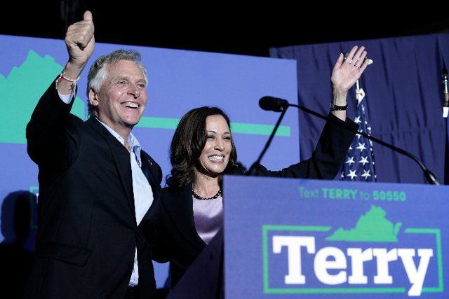 United States Vice President Kamala Harris, right, and Terry McAuliffe, the Democratic Party nominee for Governor of Virginia, left, greet the audience at his campaign event in Dumfries, Virginia on Thursday, October 21, 2021. Credit: Yuri Gripas \/ Pool via