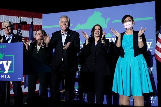 United States Vice President Kamala Harris greets the audience with Terry McAuliffe, the Democratic Party nominee for Governor of Virginia, at his campaign event in Dumfries, Virginia on Thursday, October 21, 2021. Pictured from left to right: Virginia Attorney General Mark Herring, Dorothy McAuliffe, Terry McAuliffe, VP Harris, and Lieutenant Governor candidate Hala Ayala. Credit: Yuri Gripas \/ Pool via