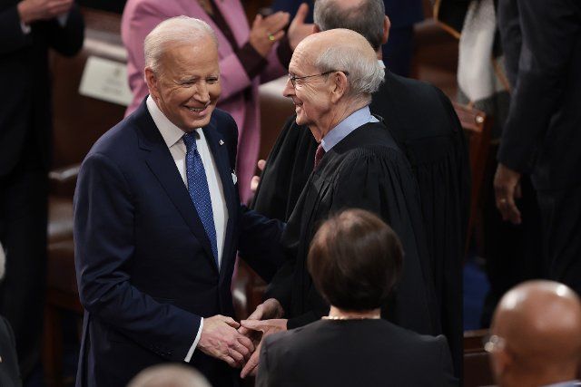 WASHINGTON, DC - MARCH 01: U.S. President Joe Biden (L) greets Supreme Court Associate Justice Stephen Breyer as Biden arrives to deliver the State of the Union address during a joint session of Congress in the U.S. Capitol\