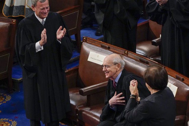 Chief Justice of the United States John Roberts and Supreme Court Associate Justice Elena Kagan applaud retiring Supreme Court Associate Justice Stephen Breyer as President Joe Biden delivers his first State of the Union address to a joint session of Congress, at the Capitol in Washington, Tuesday, March 1, 2022. Credit: J. Scott Applewhite \/ Pool via