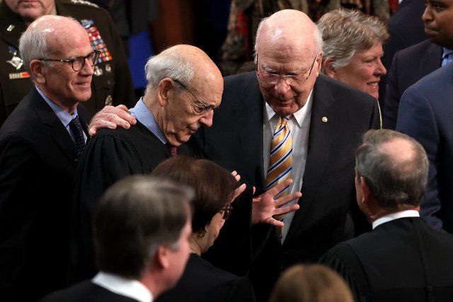 Supreme Court Justice Stephen Breyer speak with Sen. Patrick Leahy (D-Vt.) after President Biden gave his State of the Union address during a joint session of Congress at the U.S. Capitol in Washington, D.C., on Tuesday, March 1, 2022. Credit: Julia Nikhinson \/ Pool via