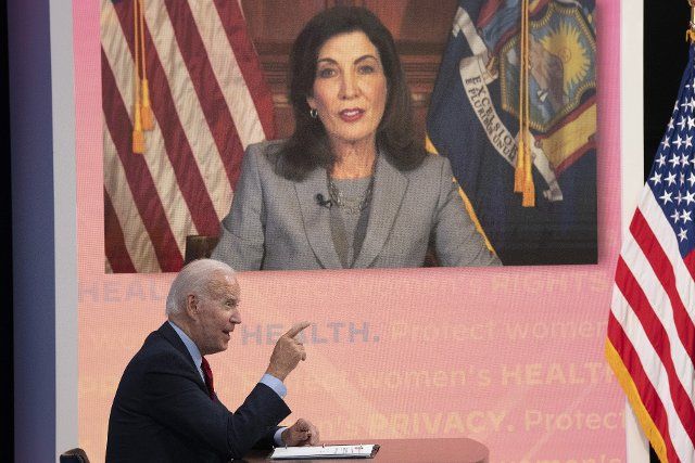 United States President Joe Biden speaks to Governor Kathleen Hochul (D-NY) during a meeting with governors to discuss efforts to protect access to reproductive health care in the South Court Auditorium in Washington, DC, July 1, 2022. Credit: Chris Kleponis 