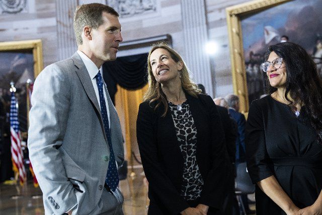 UNITED STATES - JULY 14: From left, United States Representative Conor Lamb (Democrat of Pennsylvania), US Representative Mikie Sherrill (Democrat of New Jersey), and US Representative Rashida Tlaib (Democrat of Michigan), talk before the remains of Hershel Woodrow Woody Williams, the last Medal of Honor recipient of World War II to pass away, were to lie in honor in the U.S. Capitol Rotunda in Washington, D.C., on Thursday, July 14, 2022. Williams, who passed away at age 98, received the award for action in the Battle of Iwo Jima. Credit: Tom Williams \/ Pool via