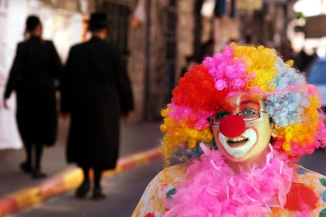 JERUSALEM - MARCH 05: Israeli woman dressed up with a clow costume during the Jewish holiday Purim on March 05 2007 in Mea Shearim in Jerusalem, Israel