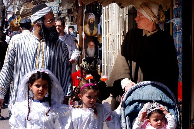 JERUSALEM - MARCH 05: Ultra-orthodox Jewish family celebrates the Jewish holiday Purim on March 05 2007 in Mea Shearim in Jerusalem, Israel
