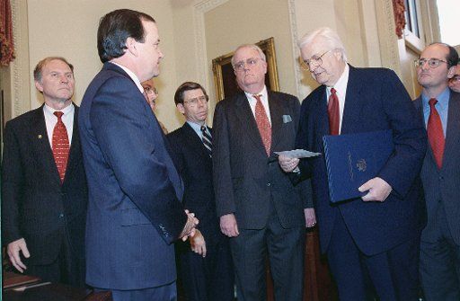 12\/19\/98 IMPEACHMENT VOTE-- House Judiciary Chairman Henry Hyde R-Ill. delivers the Articles of Impeachment against President Bill Clinton just passed on the House floor to Secretary of the Senate Gary Sisco. Looking on are committee members Steve ...