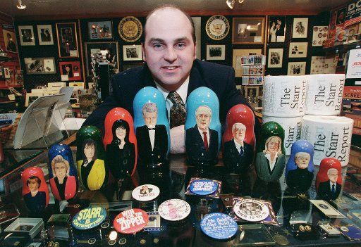 2\/9\/99 IMPEACHMENT MEMORABILIA--Thane Fake manager of "Political Americana" a shop in Union Station with nesting dolls of Clinton scandal personalities made by Treasures from Russia a company in Moscow and buttons with messages from both sides ...