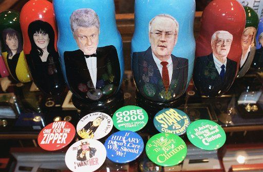 2\/9\/99 IMPEACHMENT MEMORABILIA--Nesting dolls of Clinton scandal personalities made by Treasures from Russia a company in Moscow and buttons with messages from both sides of the issue in "Political Americana" a shop in Union Station. The dolls ...