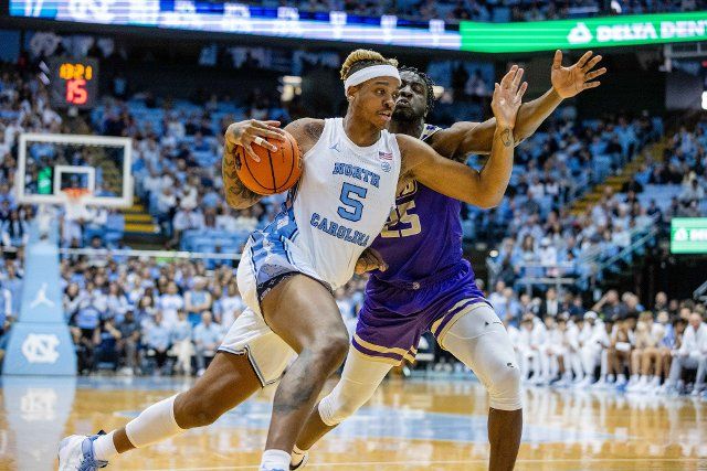 November 20, 2022: North Carolina Tar Heels forward Armando Bacot (5) drives to the basket against James Madison Dukes forward Alonzo Sule (25) during the first half of the NCAA basketball matchup at Dean Smith Center in Chapel Hill, NC. (Scott Kinser\/CSM