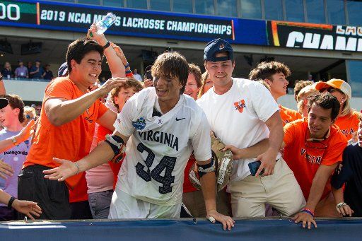 May 27, 2019: Virginia Cavaliers midfielder John Fox (34) celebrates with the fans in the stands following the championship in the NCAA Division I men\