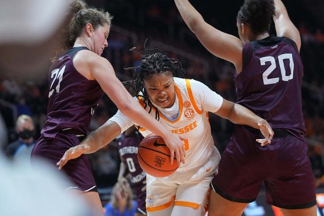 November 10, 2021: Keyen Green #13 of the Tennessee Lady Vols tries to drives to the basket against Gabby Walker #20 and Payton McCallister #21 of the Southern Illinois Salukis during the NCAA basketball game between the University of Tennessee Lady Volunteers and the Southern Illinois University Salukis at Thompson-Boling Arena in Knoxville TN Tim Gangloff