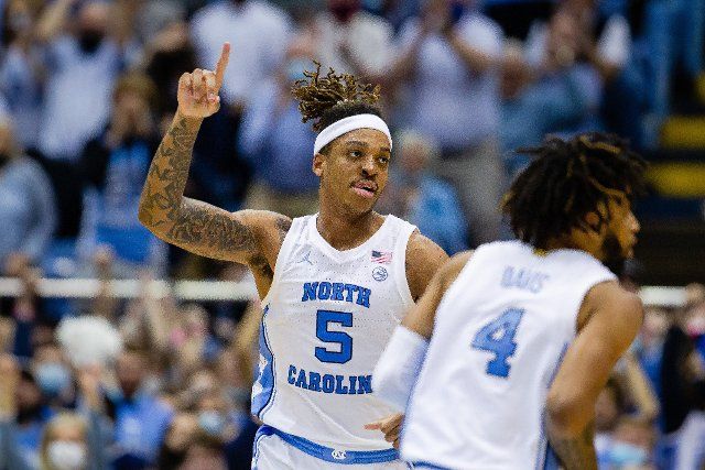 February 21, 2022: North Carolina Tar Heels forward Armando Bacot (5) celebrates after his dunk against the Louisville Cardinals in the second half of the ACC basketball matchup at Dean Smith Center in Chapel Hill, NC. (Scott Kinser\/Cal Sport Media