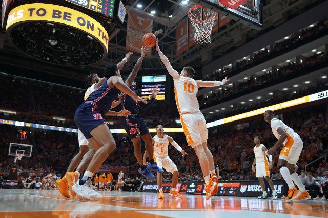 February 26, 2022: Wendell Green Jr. #1 of the Auburn Tigers drives to the basket against the defense by John Fulkerson #10 of the Tennessee Volunteers during the NCAA basketball game between the University of Tennessee Volunteers and the Auburn Tigers at Thompson Boling Arena in Knoxville TN Tim Gangloff