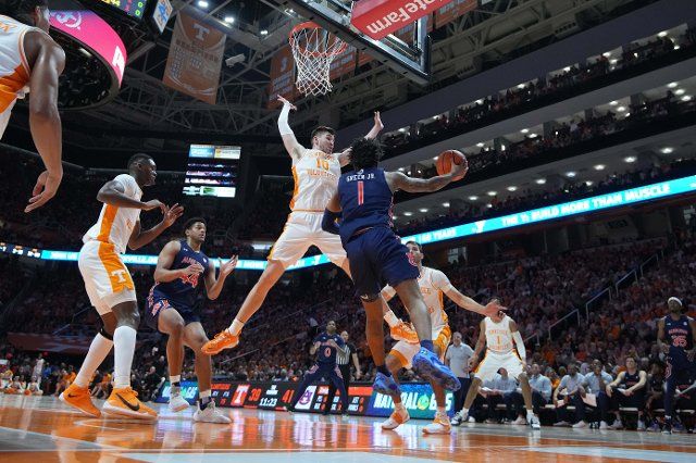 February 26, 2022: John Fulkerson #10 of the Tennessee Volunteers defends against Wendell Green Jr. #1 of the Auburn Tigers during the NCAA basketball game between the University of Tennessee Volunteers and the Auburn Tigers at Thompson Boling Arena in Knoxville TN Tim Gangloff