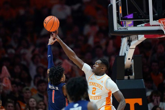 February 26, 2022: Brandon Huntley-Hatfield #2 of the Tennessee Volunteers blocks the shot attempt by Wendell Green Jr. #1 of the Auburn Tigers during the NCAA basketball game between the University of Tennessee Volunteers and the Auburn Tigers at Thompson Boling Arena in Knoxville TN Tim Gangloff