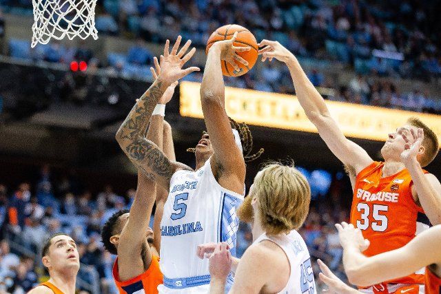 February 28, 2022: North Carolina Tar Heels forward Armando Bacot (5) gets his shot blocked by Syracuse Orange guard Buddy Boeheim (35) during the first half of the ACC basketball matchup at Dean Smith Center in Chapel Hill, NC. (Scott Kinser\/Cal Sport Media