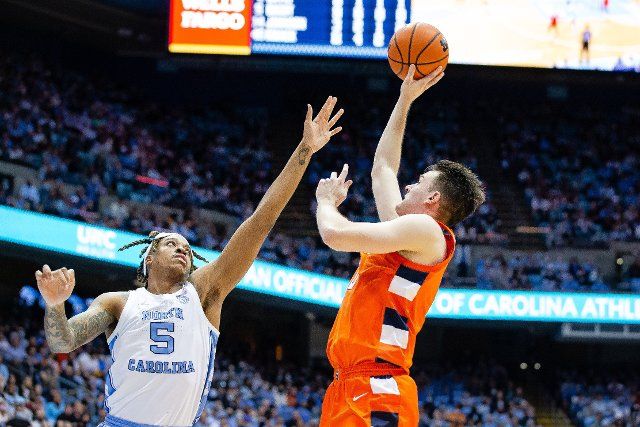 February 28, 2022: North Carolina Tar Heels forward Armando Bacot (5) guards the shoot from Syracuse Orange forward Jimmy Boeheim (0) during the second half of the ACC basketball matchup at Dean Smith Center in Chapel Hill, NC. (Scott Kinser\/Cal Sport Media