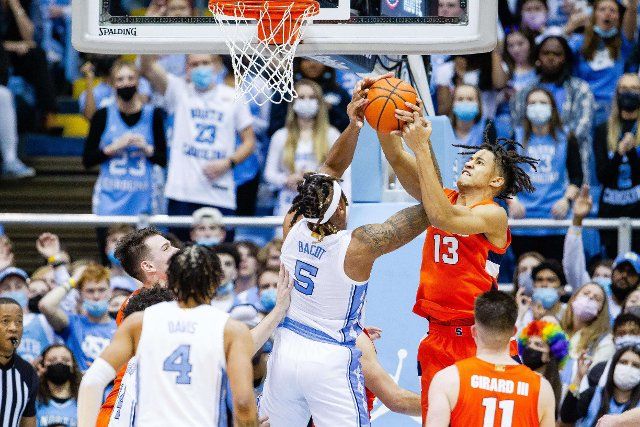 February 28, 2022: North Carolina Tar Heels forward Armando Bacot (5) battles with Syracuse Orange forward Benny Williams (13) as he goes up during the second half of the ACC basketball matchup at Dean Smith Center in Chapel Hill, NC. (Scott Kinser\/Cal Sport Media