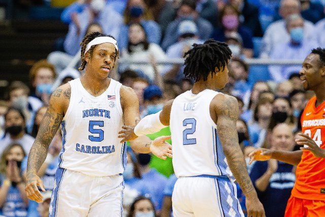 February 28, 2022: North Carolina Tar Heels forward Armando Bacot (5) and North Carolina Tar Heels guard Caleb Love (2) celebrates after scoring late in the second half of the ACC basketball matchup at Dean Smith Center in Chapel Hill, NC. (Scott Kinser\/Cal Sport Media