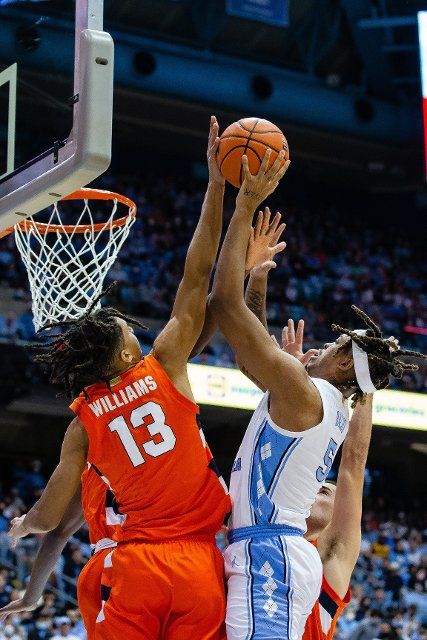 February 28, 2022: Syracuse Orange forward Benny Williams (13) gets the block but gives up the foul on North Carolina Tar Heels forward Armando Bacot (5) during the first half of the ACC basketball matchup at Dean Smith Center in Chapel Hill, NC. (Scott Kinser\/Cal Sport Media