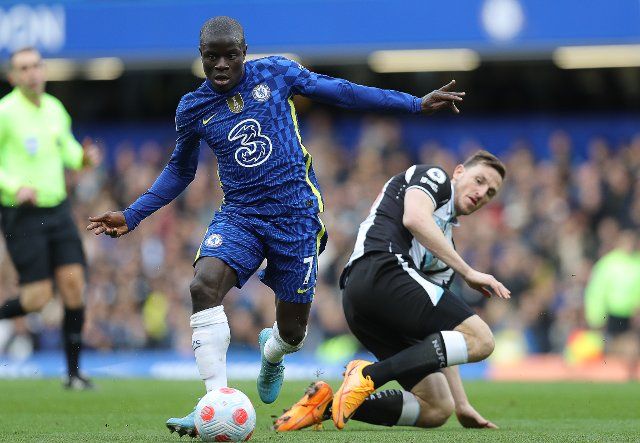 March 13, 2022, London, United Kingdom: London, England, 13th March 2022. Ngolo Kante of Chelsea and Chris Wood of Newcastle United challenge for the ball during the Premier League match at Stamford Bridge, London. Picture credit should read: Paul Terry 