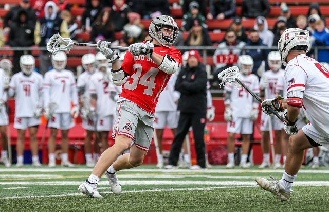 March 27, 2022: Ohio St. midfielder James Gurr (34) fires off a shot during an NCAA lacrosse game between the Ohio State Buckeyes and the Rutgers Scarlet Knights at SHI Stadium in Piscataway, NJ. Rutgers defeated Ohio State 18-7. Mike Langish\/Cal Sport Media