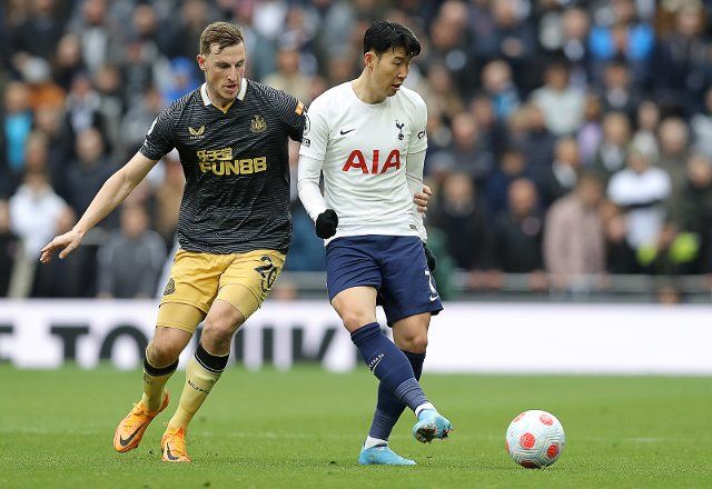 April 3, 2022, London, United Kingdom: London, England, 3rd April 2022. Son Heung-Min of Tottenham Hotspur and Chris Wood of Newcastle United challenge for the ball during the Premier League match at the Tottenham Hotspur Stadium, London. Picture credit should read: Paul Terry 