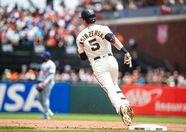 June 12 2022 San Francisco CA, U.S.A. San Francisco right fielder Mike Yastrzemski (5) steps on first base after hitting a home run during the MLB game between the Los Angeles Dodgers and the San Francisco Giants. The Giants won 2-0 at Oracle Park San Francisco Calif. Thurman James 