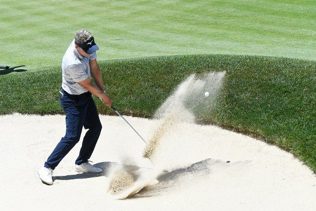 June 25, 2022: Luke Donald, of England, hits out of the sand on the 15th hole during the third round of the PGA Travelers Championship golf tournament held at TPC River Highlands in Cromwell CT. Mandatory Credit Eric Canha\/Cal Sport
