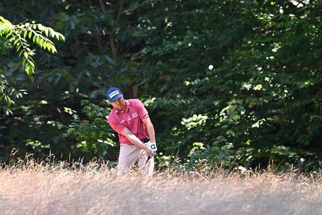 June 25, 2022: Austin Cook, of Jonesboro, AR, hits out of the tall grass on the 14th hole during the third round of the PGA Travelers Championship golf tournament held at TPC River Highlands in Cromwell CT. Mandatory Credit Eric Canha\/Cal Sport