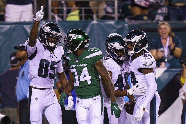August 12, 2022: Philadelphia Eagles running back Kennedy Brooks (49) celebrates his touchdown with teammates as wide receiver Deon Cain (85) has words with New York Jets corner Justin Hardee (34) during the NFL pre-season game between the New York Jets and the Philadelphia Eagles at Lincoln Financial Field in Philadelphia, Pennsylvania. Christopher Szagola