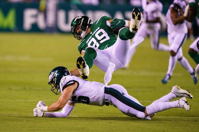 August 12, 2022: New York Jets tight end Jeremy Ruckert (89) gets upended by Philadelphia Eagles safety Reed Blankenship (46) during the NFL pre-season game between the New York Jets and the Philadelphia Eagles at Lincoln Financial Field in Philadelphia, Pennsylvania. Christopher Szagola