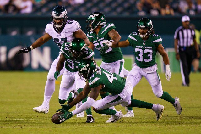 August 12, 2022: New York Jets linebacker Jamien Sherwood (44) picks up the loose ball to end the game during the NFL pre-season game between the New York Jets and the Philadelphia Eagles at Lincoln Financial Field in Philadelphia, Pennsylvania. Christopher Szagola