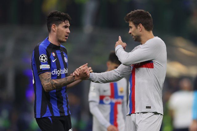 October 4, 2022, Milan, United Kingdom: Milan, Italy, 4th October 2022. Alessandro Bastoni of FC Internazionale shakes hands with Gerard Pique of FC Barcelona following the final whistle of the UEFA Champions League Group C match at Giuseppe Meazza, Milan