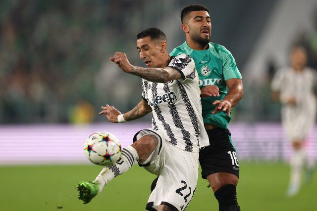 October 5, 2022, Turin, United Kingdom: Turin, Italy, 5th October 2022. Mohammad Abu Fani of Maccabi Haifa clashes with Angel Di Maria of Juventus as he lines up a shot on goal during the UEFA Champions League match at Allianz Stadium, Turin