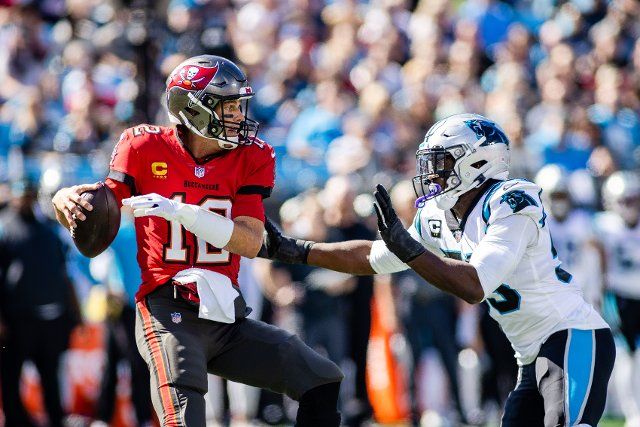 October 23, 2022: Tampa Bay Buccaneers quarterback Tom Brady (12) gets sacked by Carolina Panthers defensive end Brian Burns (53) during the first quarter of the NFL matchup in Charlotte, NC. (Scott Kinser\/Cal Sport Media