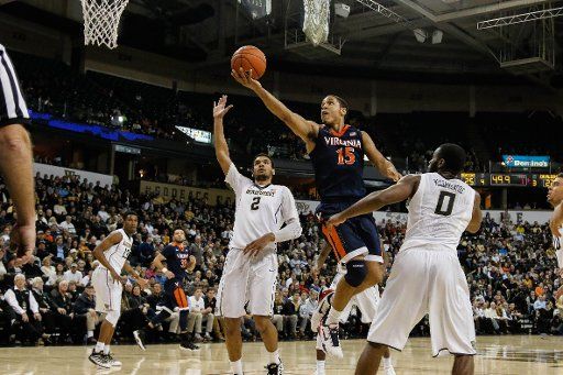 January 26, 2016: Malcolm Brogdon (15) of the Virginia Cavaliers floats in a layup in the NCAA Basketball match-up between the Virginia Cavaliers and the Wake Forest Demon Deacons at Lawerence Joel Veteran Memorial Coliseum in Winston-Salem, NC. ...