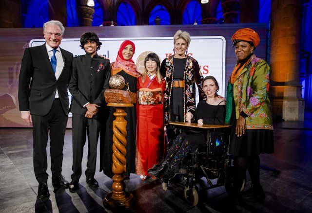 2022-11-14 16:46:07 THE HAGUE - Rena Kawasaki from Osaka, Japan, (M) is photographed with Nobel Prize winner Tawakkol Karman (3rd L) and Princess Laurentien (3rd R) in the Grote Kerk after the presentation of the Children\