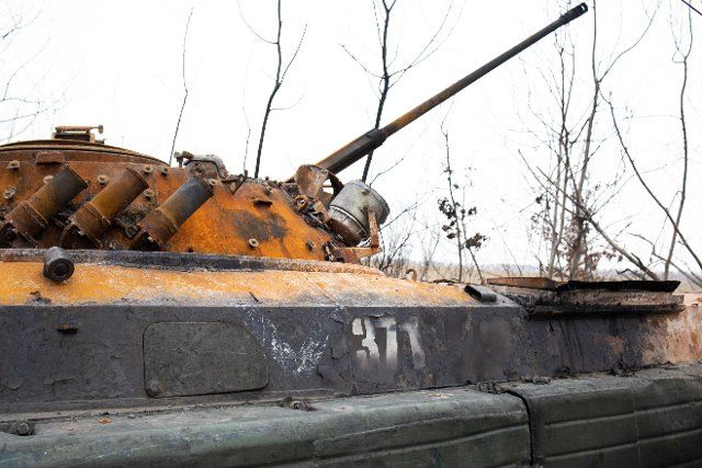 V sign written on a Russian Bronetransporter BTR vehicle destroyed by Ukrainian Army as Volunteers of the Civilian defense show former Russian Positions in Sytnyaky near Makariv in the Kiev Oblast, on March 26, 2022 during the Russian Invasion of Ukraine. Photo by Raphael Lafargue\/ABACAPRESS