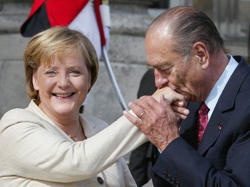 French President Jacques Chirac (R) kisses the hand of German Chancellor Angela Merkel as they bid farewell to each other at the end of their tripartite summit, at the Chateau de Compiegne, north of Paris, September 23, 2006. Photo by Eco Clement\/UPI\/ABACAPRESS.