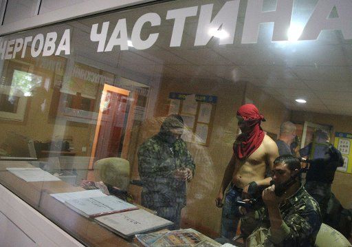 Federalism supporters inside the occupied police station in the town of Krasnoarmeisk, Donetsk region, eastern Ukraine on May 1, 2014. Photo by Mikhail Pochuyev\/Itar-Tass\/ABACAPRESS.
