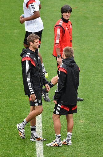 German head coach Joachim Loew and players Thomas Mueller (L) and Philipp Lahm during a training session at the Estadio Beira-Rio in Porto Alegre, Brazil, June 29, 2014. Germany faces Algeria in a FIFA soccer World Cup round of sixteen match on 30 ...