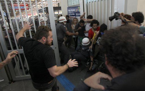 Protesters clash with police in Tatuape subway station, east of Sao Paulo, southeastern Brazil, during protest against spending on the World Cup on June 12, 2014. Photo by Werther Santana\/Estadao Conteudo\/DPA\/ABACAPRESS.