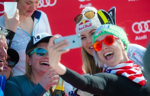 Winner Lindsey Vonn from the US (back, c) poses for a photo with her team colleague from the US ski team during the victory ceremony of the women\